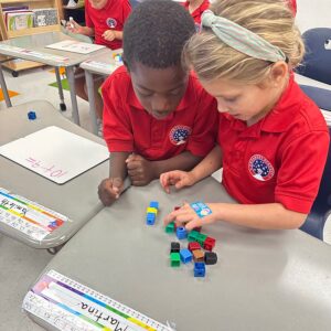 Students playing a block game